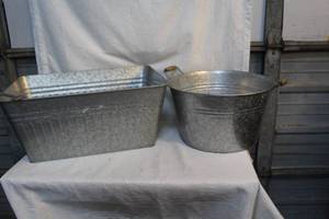 lot 107 image: Two metal tubs one with a bottle opener