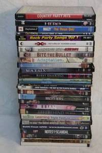 lot 200 image: Large lot of DVDs titles like family guy,left behind, sesame Street, duck Man, matrix,two brothers, and many more