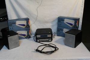 lot 125 image: CD player radio and 4 unopened cleaning boxs