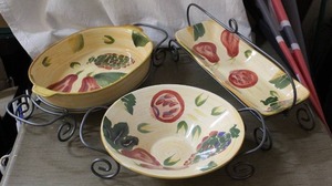 lot 2 image: set of three ceramic serving dishes hand painted in a wire carrying rack
