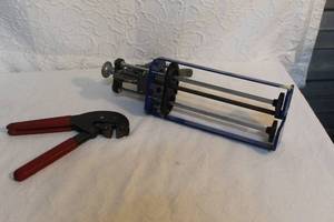 lot 192 image: hex crimping tool. And caulking gun,