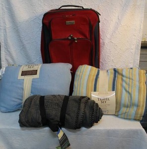 lot 178 image: 2-Travel set blanket and pillow a throw and a suitcase