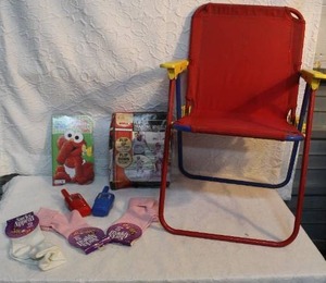 lot 175 image: Kids lot fold up chair and training wheels book and more see pictures