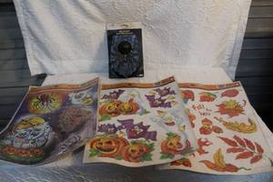 lot 165 image: Window clings and a light up doorbell decor