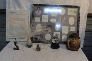 lot 162 image: a piece of folk art or junk art made from recycled metal parts, with a spark plug forming the head and torso.,caved coconut, Nikki snow globe, picture frame,and so much more see pictures