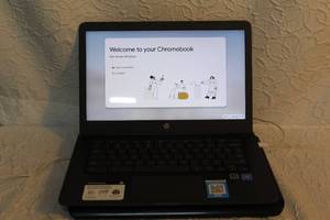 lot 225 image: HP Chromebook touch screen laptop with Trey fan but the fan needs a plug