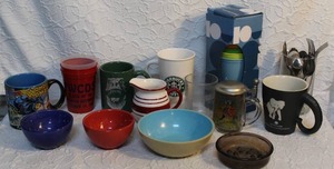 lot 232 image: Mixed lot of cups Wonder woman Starbucks and more glass full of silverware and much more see pictures