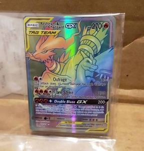 lot 3 image: POKEMON Reshiram & Charizard GX  217214