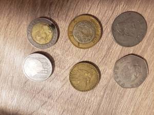 lot 26 image: 6 foriegn  coins