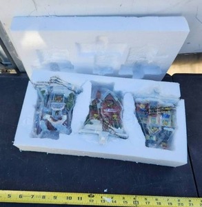 lot 23 image: Glitzhome Christmas Stocking Holder, Set of 3 Resin Bakery Shop, Toy Shop, and Toy Shop - Fireplace Counter Window Xmas Holiday Decoration