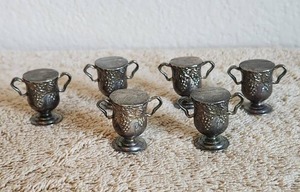 lot 103 image: Set of 6 Godinger Silver plated urns & grapes place card holders