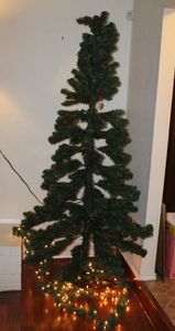 lot 38 image: Approx, 8 FT Tree with Lighted Garland