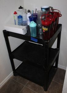 lot 173 image: Black Shelf and Variety of on the go Drink Holders