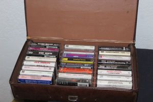 lot 202 image: Variety of Cassette Tapes and Cassette Holder Case
