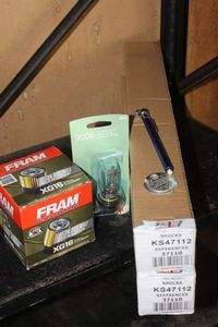 lot 283 image: Automotive Shocks, Oil Filter, Headlight, and more