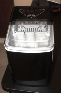 lot 14 image: Portable, countertop Ice Maker, Model Slim01B, Makes two different Size Bullet Ice Cubes, Has Basket and scoop