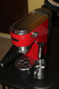 lot 15 image: Portable, Countertop Red Espresso Maker with Manual Frothier