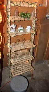 lot 307 image: Leaning Shelf with Ivy and clear Lights, Small decroative Stool