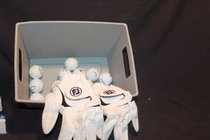 lot 388 image: Two Golf Gloves and Golf Balls