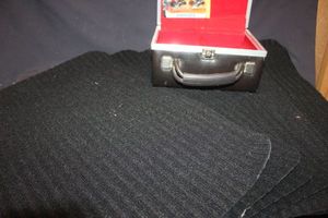 lot 417 image: 8 Track Tape Case, H11 Headlight Bulbs, and outdoor mats