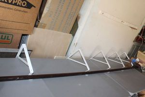 lot 428 image: 10Ft Rod With Bracket Holders