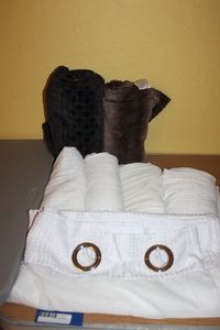 lot 471 image: White Shower Curtain, 4 Panels of White Curtains, Takes Curtain rods for Both ends, Two Soft Throw Blankets