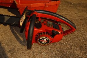 lot 7 image: Homelite chainsaw with case, model 10654 plus 40-1 fuel