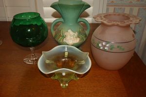 lot 10 image: Uranium glass dish, Roseville green pottery vase, Green glass goblet, and pink glass vase