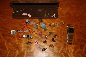 lot 17 image: Citizen gold band watch and lapel pins