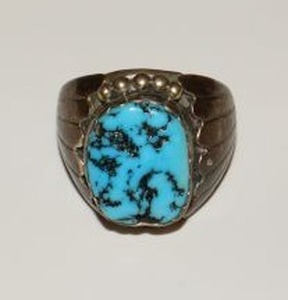 lot 20 image: Unmarked silver ring with turquoise stone