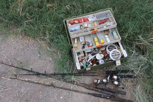 lot 217 image: Fishing lot green tackle box and fishing rods