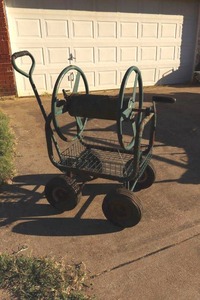lot 213 image: Garden hose reel cart (could use some new tires)