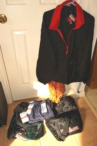 lot 42 image: Athletic bags, New shorts, New Marlboro Gear 99 windbreaker pant suit, and Catchers mitt