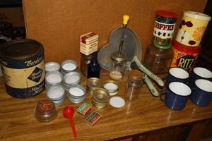 lot 73 image: Vintage jars and tins, wax and glass jar lids, metal blue speckled mugs