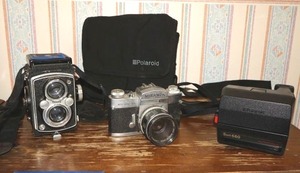 lot 70 image: Vintage cameras Polaroid Sun 660, Miranda EE, and Yashica