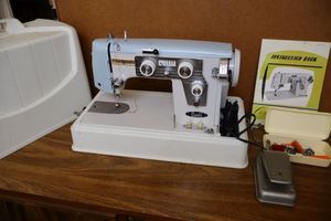 lot 45 image: Carls Dial Sew sewing machine with pedal and case, model 1704 B