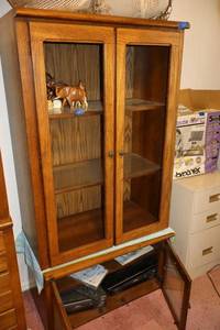 lot 110 image: Mid-century furniture. Tall cabinet has glass shelves and needs glass for doors. Short cabinet has glass doors and electronics included.