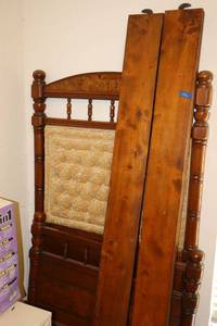 lot 106 image: Antique twin bed frame with button tufted back panel