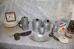 lot 68 image: Vintage kitchen items aluminum cannisters, collectible tins, coffee pot and more