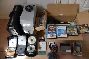 lot 81 image: Office and electronics lot Bill Blass leather briefcase, emachines T1100 tower, game controller, CD holders and more