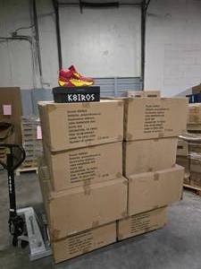 lot 22 image: Pallet of NEW K8IROS (Spencer Dinwiddle) Mark II RedYellow Mens Shoes.  10 Pairs of Shoes Per Box.  QUANTITY 16 BOXES PER PALLET  BID IS TIMES THE QUANTITY SO YOU ARE BIDDING PER BOX