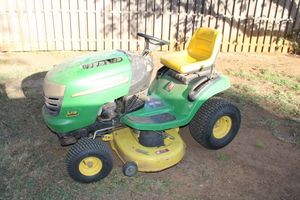 lot 1 image: John Deere riding lawn mower used it on 9th.  Wouldnt start found a part broken didnt order was replace before. Manual included as well as part number needed. See photos.