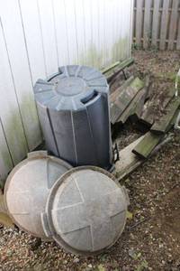 lot 91 image: Misc. wood boards plus two plastic trash cans