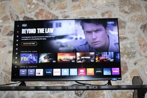 lot 49 image: Vizio TV with remote, model V4K55C-0801