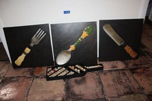 lot 102 image: Kitchen wall art metal fork, spoon, and knife, wine bottle shaped tray with corks and entry rug