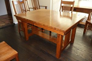 lot 33 image: Mission style Solid oak dining table with self storing leaves - 56w x 42d x 30h, each leaf 42x16