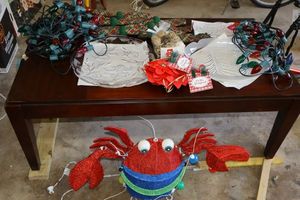 lot 187 image: Christmas clear platters, Christmas lights, napkins, and lobster decoration