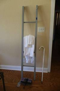 lot 237 image: Ladder style towel rack, aluminum cane and hot roller set