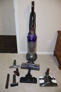lot 133 image: Dyson vacuum with some additional Shark vacuum attachments