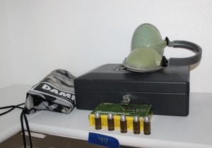 lot 44 image: Ammo - 45 auto and Remmington 12 ga buckshot cartridges, headgear, and storage boxes